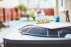 Central Air technician working on an HVAC system in Clackamas, Oregon