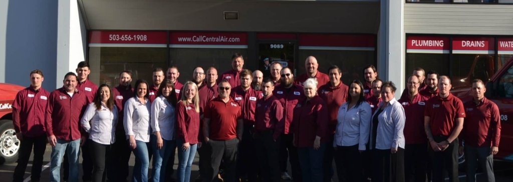 Wide-shot photograph of the Central Air team standing in front of the office