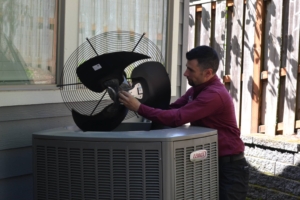 central air employee installing an air conditioner