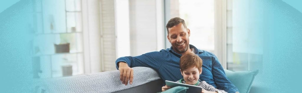 Happy father and son enjoying clean indoor air quality in Portland home.