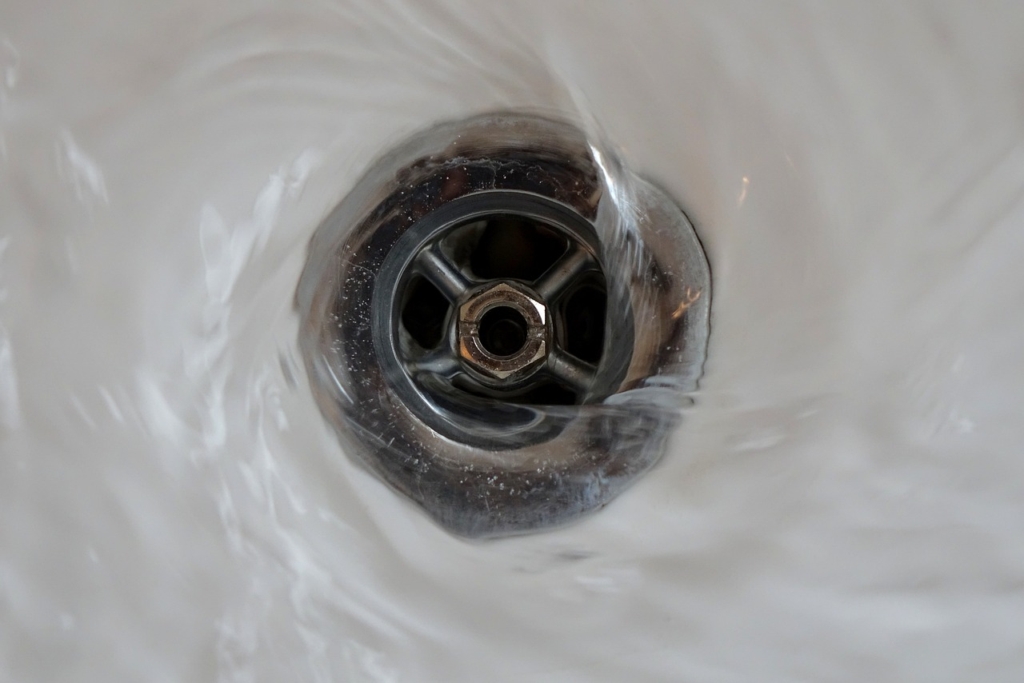 Clean drain after plumbing services in Portland home.