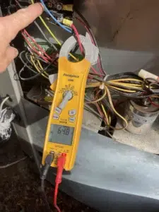 Technician replacing ECM motor module and control board during Beaverton repair service.