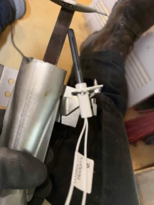 Technician servicing a furnace hot surface ignitor in Clackamas, OR.