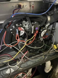 technician replacing a Goodman furnace pressure switch module in Clackamas, OR
