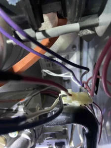 Technician servicing a furnace hot surface ignitor in Beaverton, OR