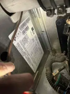 Technician inspecting a Portland furnace with airflow and error code concerns.
