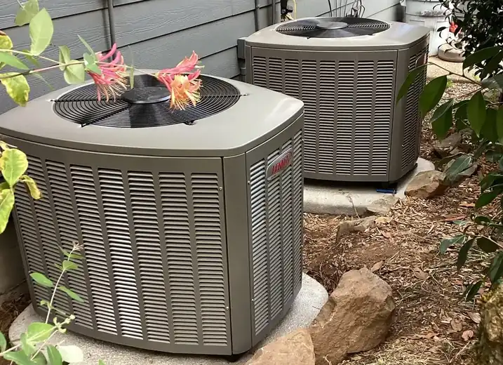 Two outdoor Lennox HVAC units beside a Portland home, with heat pump heating issues for repair.
